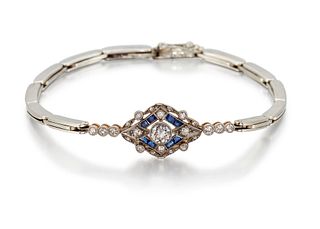 AN EARLY 20TH CENTURY DIAMOND AND SAPPHIRE BRACELET, the central round old 