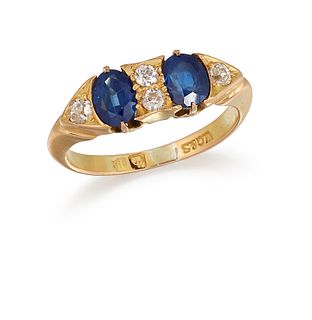 AN 18CT SAPPHIRE AND DIAMOND RING, the two oval sapphires set to centre wit