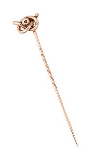 A 9CT STICK PIN, the stick pin with knotted top, stamped 9ct to pin, 54mm l