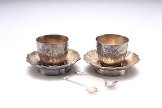 A PAIR OF CHINESE EXPORT SILVER CUPS AND SAUCERS, with associated spoons, e