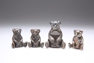 FOUR CHINESE WHITE METAL NOVELTY PEPPER POTS, each in the form of a teddy b