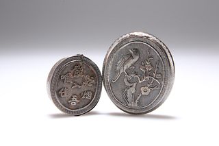 TWO CHINESE SILVER BOXES, oval, the first with hinged cover chased with a b