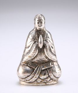 A CHINESE SILVER BUDDHA PEPPER POT,?with hands in anjali mudra, stamped SIL