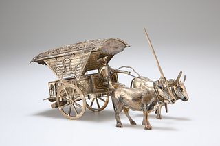 A CONTINENTAL SILVER MODEL OF A CHINESE MAN, OXEN AND CART, late 19th centu