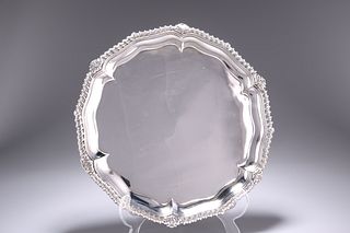 AN EARLY VICTORIAN SILVER SALVER,?London 1840, shaped circular form with sh