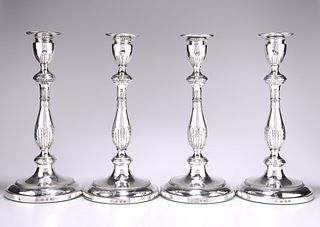 A SET OF FOUR GEORGE III SILVER CANDLESTICKS, by John Schofield, London 177