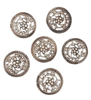 A CASED SET OF LATE VICTORIAN SILVER BUTTONS, the round buttons with repous