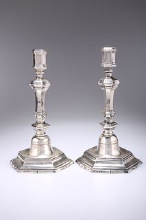 A PAIR OF 18TH CENTURY FRENCH SILVER CANDLESTICKS, hexagonal capitals on tr