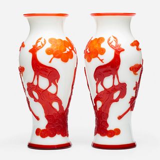 Chinese, white Peking glass 'Stag' vases with red overlay, pair