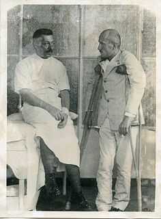<br><br>Mussolini in a military hospital, 1916<br>13 x 18 cm<br>Portrait of Mussolini during WWI, printed in 1934. Aristotype whith Trampus agency and