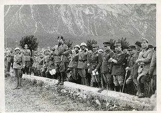 <br><br>Mussolini <br>entertains soldiers,1935<br>18 x 13 cm<br>Mussolini during a speech for soldiers, 29/8/1935.  Aristotype with stamp and cliché b