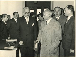 <br><br>President Luigi Einaudi during a public event, 1952<br>24 x 17 cm<br>Luigi Einaudi in a group of people. Print on baryta paper, pencil notes a