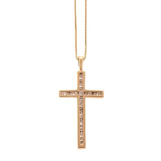 A Diamond Cross Pendant in Gold