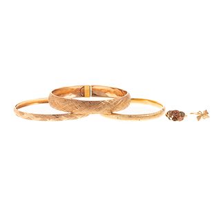 Three Bracelets & Two Rings in Yellow Gold