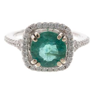 An Emerald & Diamond Halo Ring in 14K