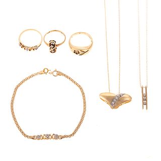An Assortment of Jewelry with Diamonds in Gold