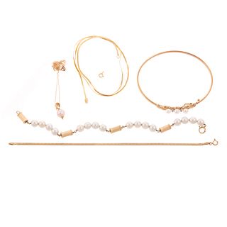 A Collection of Pearl & Gold Jewelry in Gold