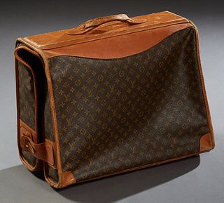 Louis Vuitton Hanging Folding Garment Bag, with leather trim, the interior with original paper label, H.- Closed- 21 in., Open- 42 i...