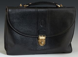 Marc Cross Black Leather Briefcase, the gold tone push lock opening to a suede and woven silk lined interior, with one center zipper...