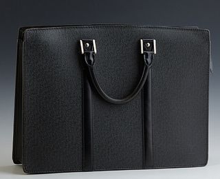 Louis Vuitton Black Taiga Leather Briefcase, with dual open compartments and a center silver toned zipper closure opening to a black...