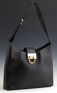 Salvatore Ferragamo Black Leather Shoulder Bag, late 20th c., with a single wide adjustable strap, the gold tone pull through lock e...