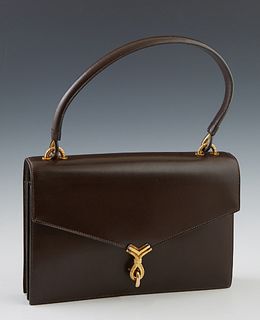 Vintage Hermes Brown Calf Leather Handbag, c. 1960, for Bonwit Teller, with a V flap closure and gold tone hardware latch, opening t...