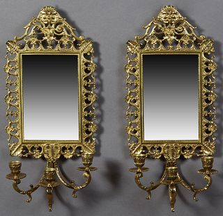 Pair of Bronze Louis XV Style Three Light Mirror Sconces, 20th c., with a relief face surmount over pierced leaf sides around a wide...