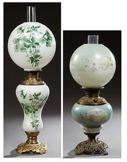 Two Late Victorian Glass and Brass Gone With the Wind Lamps, late 19th c., with floral painted ball shades and bodies, on metal feet...
