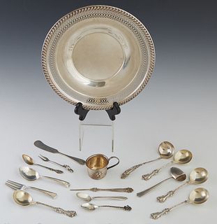 Group of Sixteen Sterling Pieces, early 20th c., consisting of a circular reticulated plate with a gadrooned rim; an English butter ...