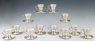 Set of Twelve Sterling Demitasse Cups and Saucers, 20th c., by SSMC (Sterling Silver Manufacturing Co.), with relief decoration, wit...