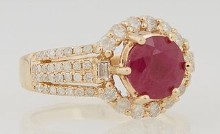 Lady's 14K Yellow Gold Dinner Ring, with a 2.16 carat circular ruby atop a border of round and baguette diamonds, the triple split s...