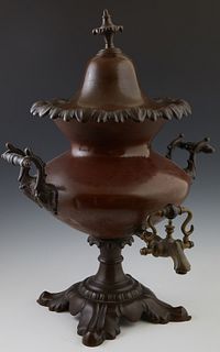 Unusual Patinated Bronze Hot Water Urn, late 19th c., the top with a floriform handle, over baluster handled sides and a brass spigo...