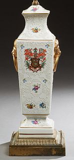 English Porcelain Table Lamp, early 20th c., of tapered square form, with enamel relief floral and armorial decoration, on a socle s...
