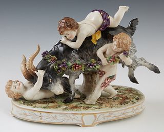 Meissen Style Porcelain Figural Group, 20th c., by Lefton, of frolicking putti with a bull, on an integral oval base, H.- 8 1/2 in., W.- 12 in., D.- 5
