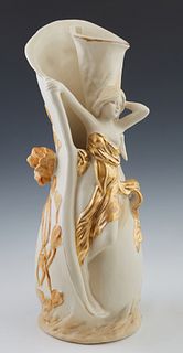 Royal Dux Art Nouveau Vase, 20th c., the rolled cylindrical white body, with relief blooming foliage surrounding the maiden covered in a green wrap wi