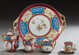 Royal Bonn Seven Piece Porcelain Tea Set, c. 1900, consisting of a tray, teapot, covered sugar, creamer, two cups, and a saucer, all with floral and c