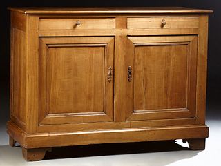 French Provincial Louis Philippe Carved Cherry Sideboard, 19th c., the rectangular rounded edge top over two long frieze drawers, above double cupboar
