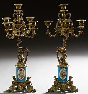 Pair of Sevres Style Bronze and Porcelain Five Light Candelabra, early 20th c., In "Heavenly Blue," the candle arms on figural putto supports to Sevre