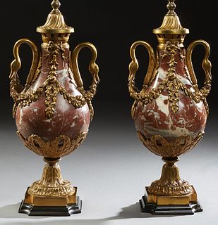 Pair of Gilt Bronze Mounted Carved Marble Lamps, 19th c., of baluster form, with gilt bronze swan's head handles joined by leaf garlands, on a socle s
