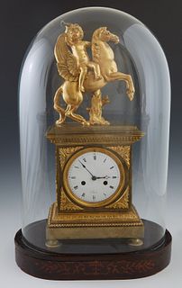 French Gilt Bronze Figural Mantel Clock, c. 1840, the surmount depicting a trumpeting putto atop a winged horse, on a stepped rectangular top over a t