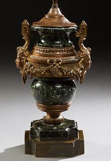 Empire Style Gilt Spelter Mounted Marble Lamp, early 20th c., of tapering urn form, the verde antico urn with relief classical masque handles, joined 
