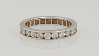 Lady's Platinum Eternity Band, mounted with 24 channel set round diamonds, total diamond weight.- 1.68 cts., size 6.
