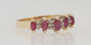Lady's 14K Yellow Gold Dinner Ring, the top with five marquise rubies, separated by four oval ribs with two three point diamonds each, total diamond w