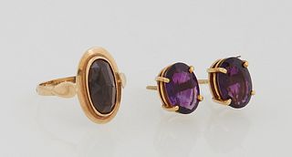 Three Pieces of 18K Yellow Gold Jewelry, consisting of a ring with a 2.5 carat oval garnet, and a pair of earrings with screw posts, each with an oval