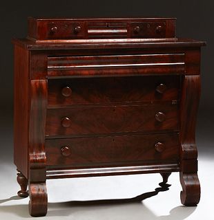 American Classical Revival Carved Mahogany Chest, 19th c., the top with a horizontal bank of three drawers over a top with a setback frieze drawer, ov