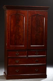 English Victorian Carved Mahogany Linen Press, 19th c., the stepped ogee crown over double peaked panel doors enclosing an interior fitted with 8 mapl