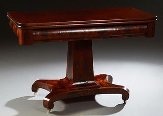 American Classical Craved Mahogany Dining Table, 19th c., the rounded corner fold over top over a wide skirt, on a tapered square support, to a quadru