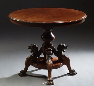 English Carved Mahogany Circular Center Table, 19th c., on a turned pedestal support to four winged gryphon supports on paw feet, H.- 29 in., Dia.- 36