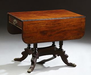 American Classical Brass Inlaid Carved Mahogany Drop Leaf Table, 19th c., with two curved leaves over one end drawer and one faux drawer, flanked by i