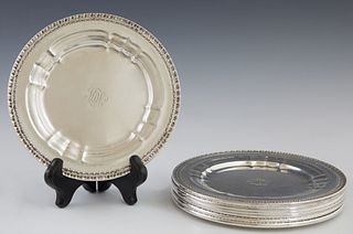 Set of Seven Sterling Bread and Butter Plates, 20th c., by Dominick and Haff, in the "La Salle" pattern, monogrammed "MWL," H.- 3/8 in., Dia.- 6 1/2 i